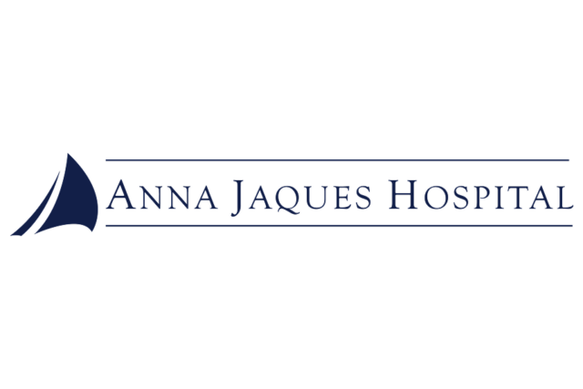 Logo of Anna Jaques Hospital featuring a sail design on the left.