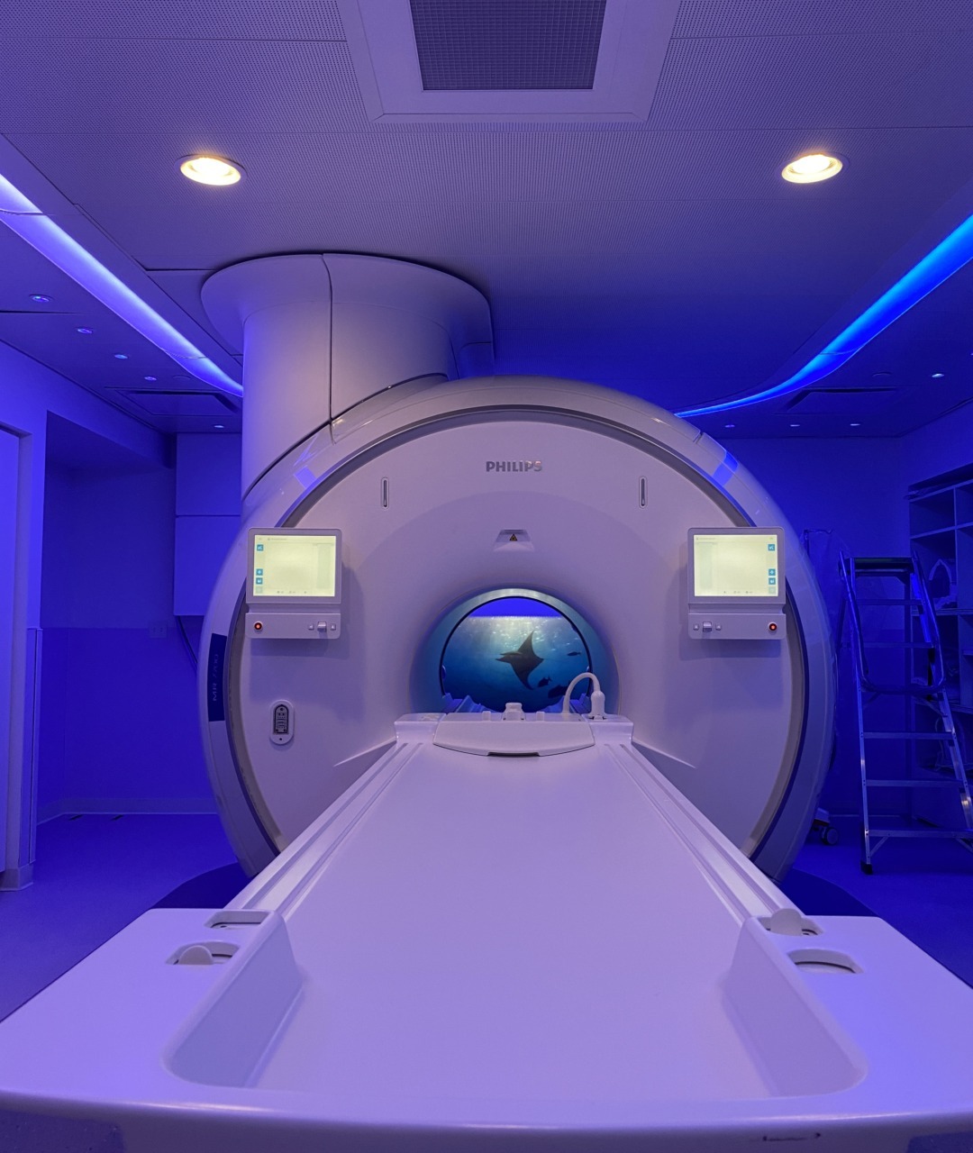 MRI machine in a medical facility with blue ambient lighting