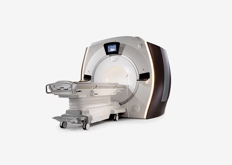 MRI machine with a patient bed on a white background