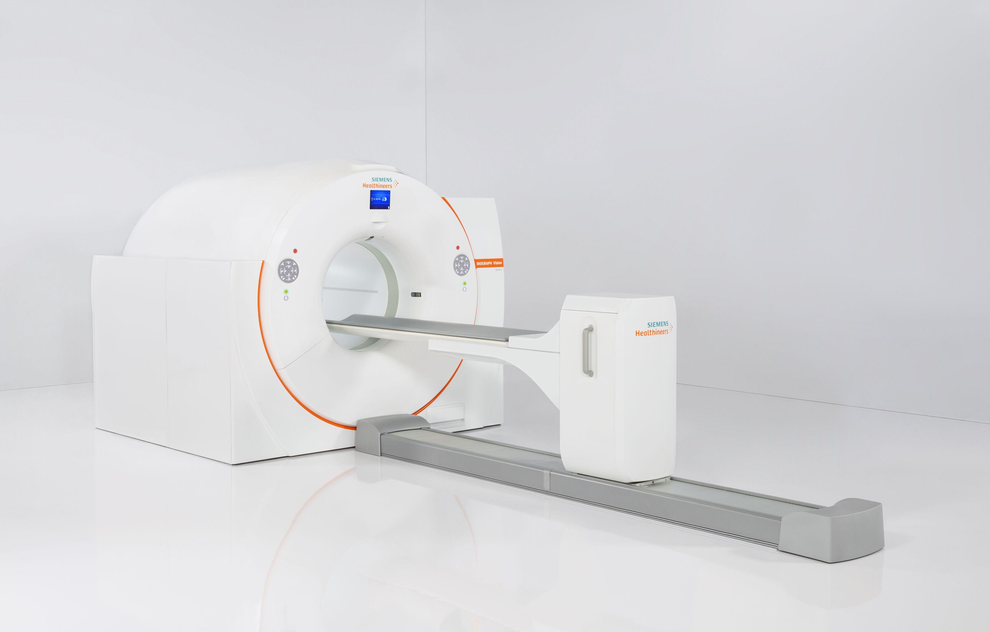 MRI machine in a white room with an extended table used for medical imaging and diagnostic purposes