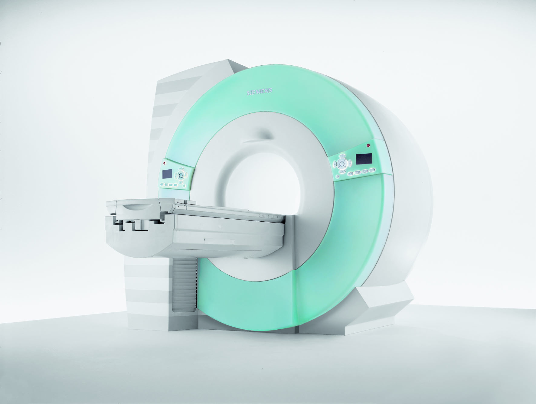 Modern MRI machine with light green accents in a medical imaging room.